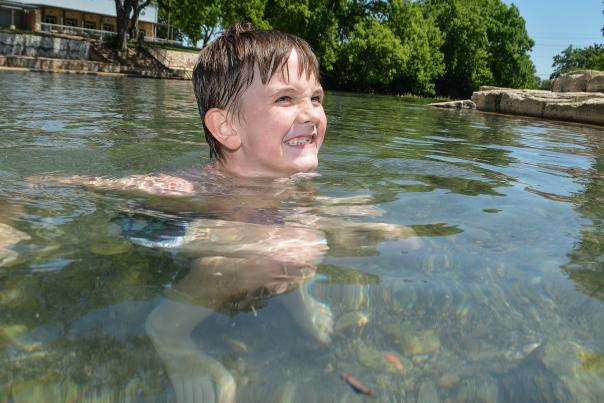 Young boy in river