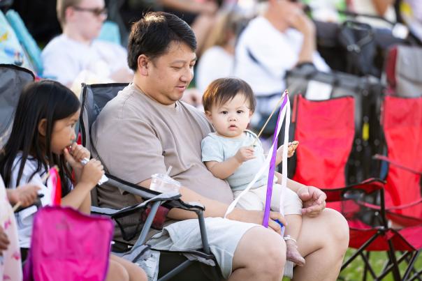 Father and young kids enjoying a festival in Woodbury
