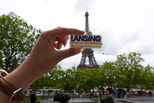 Lansing Sports Commission sticker in front of Eiffel Tower