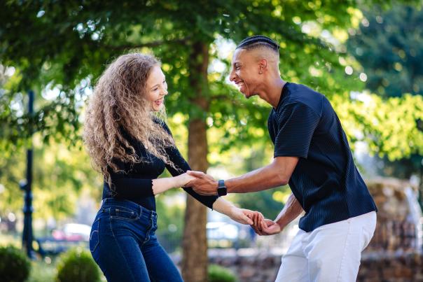 A couple dances together in a park in the Poconos.