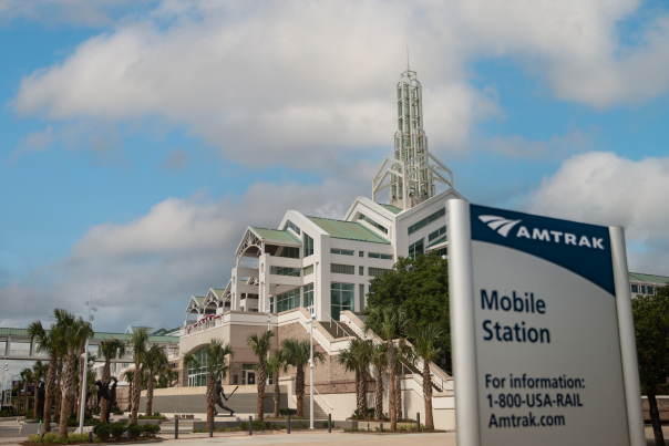 Photo of Amtrak Mobile Station sign outside of Arthur R. Outlaw Mobile Convention Center