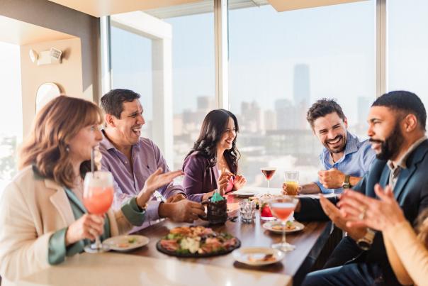 Group of friends drinking and eating at O Bar