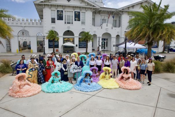 Group of people with Azalea Trail Maids in front of the History Museum