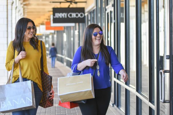 Two women shop at the San Marcos Outlets