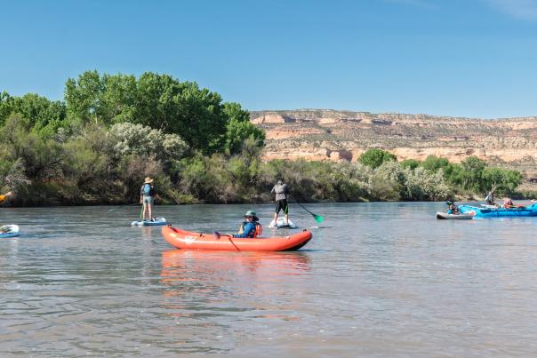 View of People on the Colorado River with Colorado National Monument in the Background