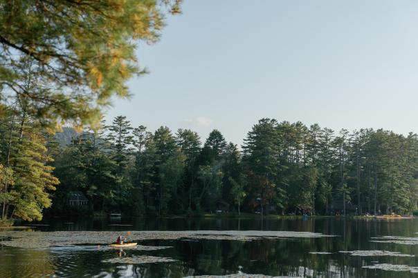 Woman paddling on Lake Vanare at Hide-a-way Waterfront Cottages