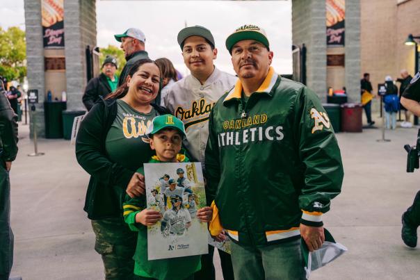 Family of four at an Athletics game in Sacramento