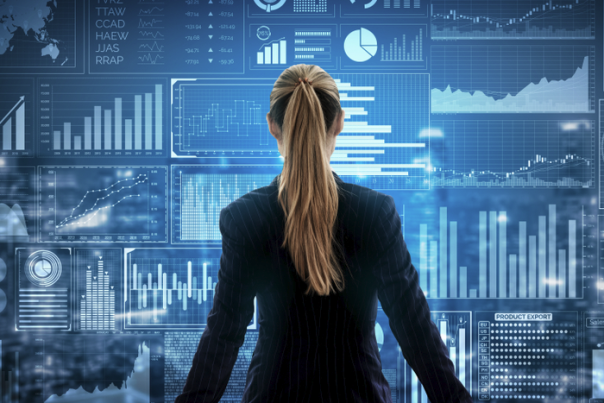 Woman and metrics on screen in front of her