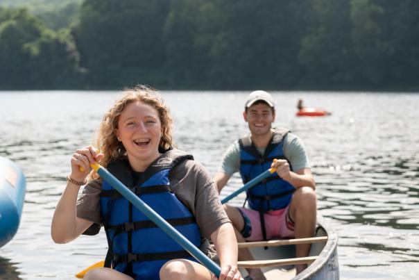 A couple enjoys a day of canoeing on the Delaware River in the Poconos with Chamberlain Canoes.
