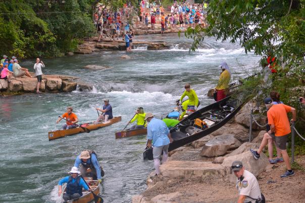 Texas Water Safari kayak racers portage at Rio Vista Falls