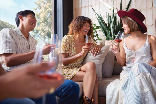 Friends on couch with wine