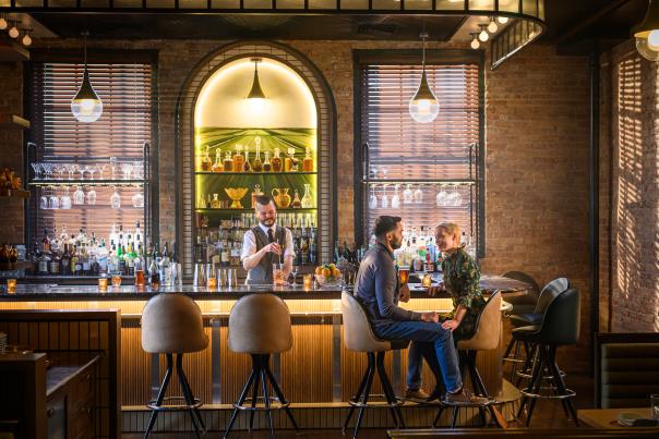 2 people sit at a bar in Madison, Wisconsin