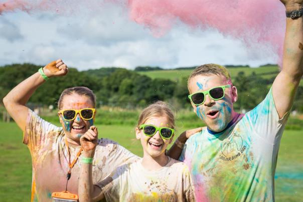 family covered in coloured paint
