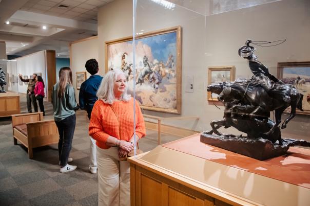 Woman looking at a sculpture at the Cowboy Museum