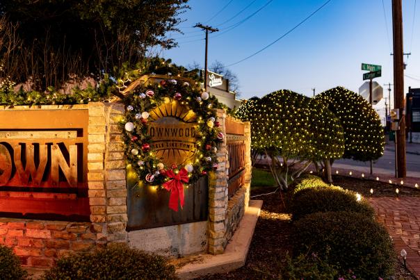 Photo of the Downtown Entry way on Center avenue featuring a Christmas Wreath and other christmas lights on display for the Holiday season.