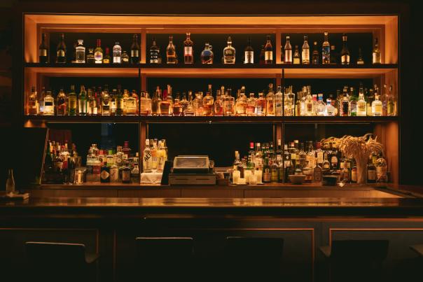 Alcohol bottles behind a bar