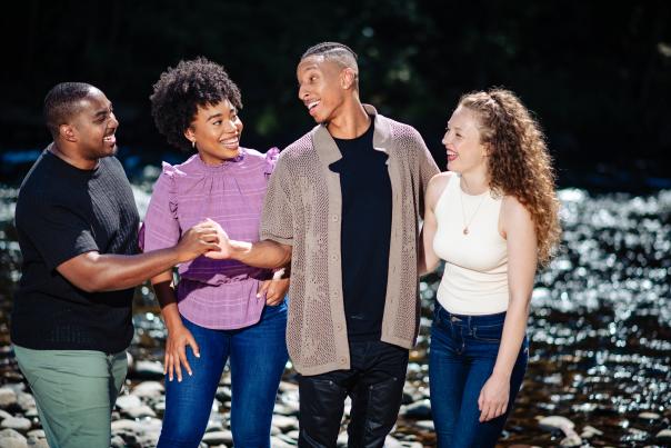 Two couples enjoy a sunny day near the Lehigh River in the Poconos.