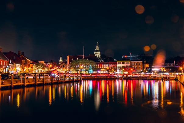 Ambient lights of red, yellow, orange, green reflecting off of City dock waters