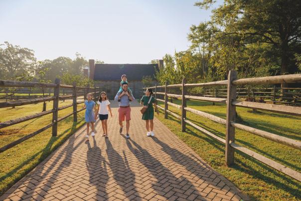 Family Walking Farmhouse