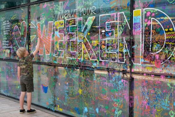 We Invented the Weekend - boy drawing on window as part of festival activities