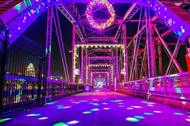 The Purple People bridge that leads from Cincinnati, Oh to Newport, Ky lit up in purple, green, white and pink lights for the holiday season