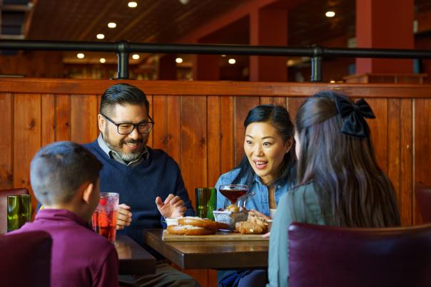 A family enjoys a meal together at Skytop Lodge in the Poconos.