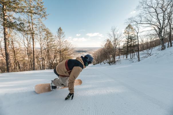 A snowboarder enjoys a run at Camelback Mountain in the Poconos.