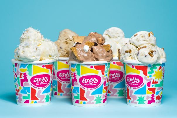 Five cups of Amy's Ice Creams in various flavors, scooped high in their cups.