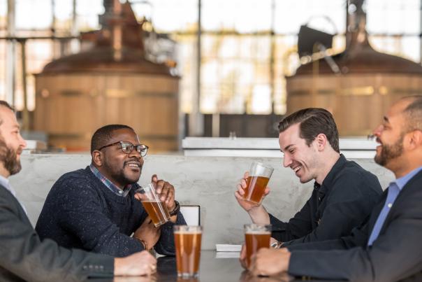 Group of men drinking beer at brewery in Columbia, SC