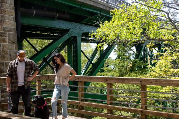 A couple and their dog at the Cut River Bridge in the Upper Peninsula of Michigan