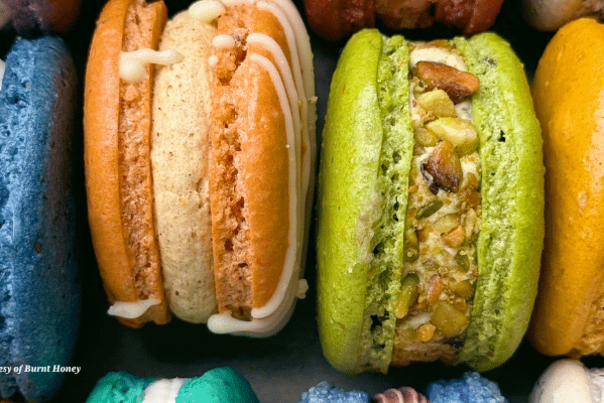 Four macaroons of different flavours.