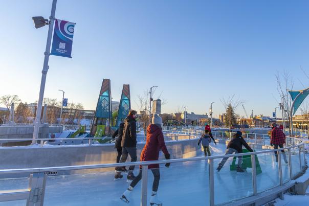 Ice skaters glide on the ice ribbon at Howard Park in downtown South Bend