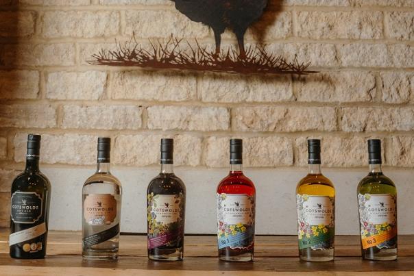 A line of Cotswold Distillery bottles of whisky