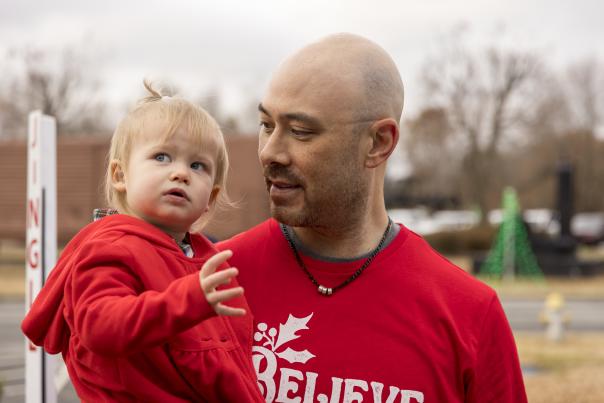 Holiday photo of dad holding kid