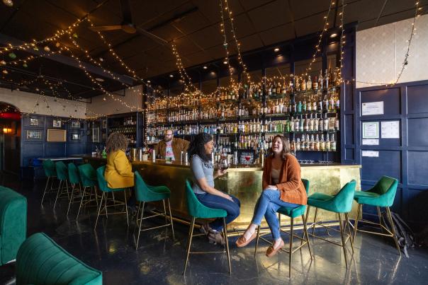Three people enjoy drinks at Foxbriar Cocktail Bar in Paducah, KY.