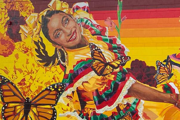 mural of dancers in traditional dresses with butterflies