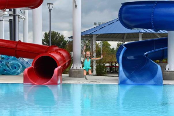 Girl jumping into pool at Freedom Springs in Festival Country, Indiana
