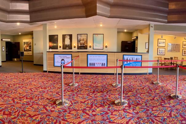 The lobby of City Lights with roped line area to concessions.