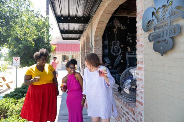 Ladies on sidewalk in Bossier City East Bank District & Plaza