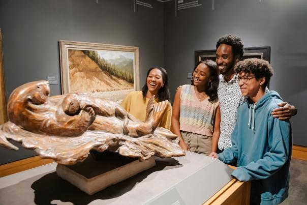 Black family looking at a sculpture at the Cowboy Museum