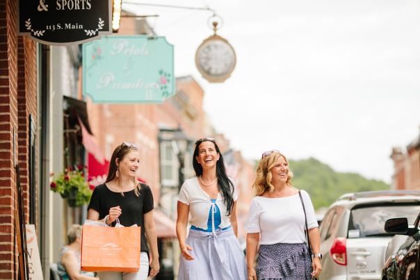 Three women shopping on Main Street Galena