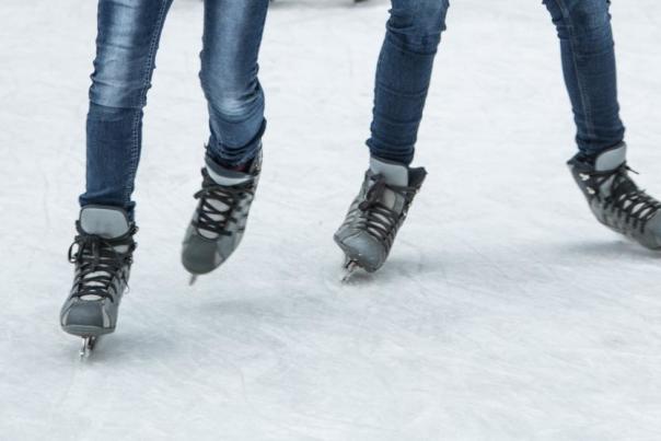 Close-up of ice skates on an ice rink (photo: CincinnatiUSA.com)