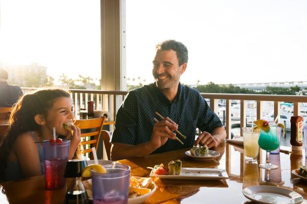 Father and Daughter enjoying outdoor, waterfront dining in Punta Gorda