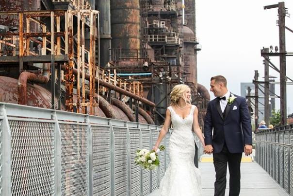 Married couple walks along the Hoover Mason Trestle in South Bethlehem after wedding