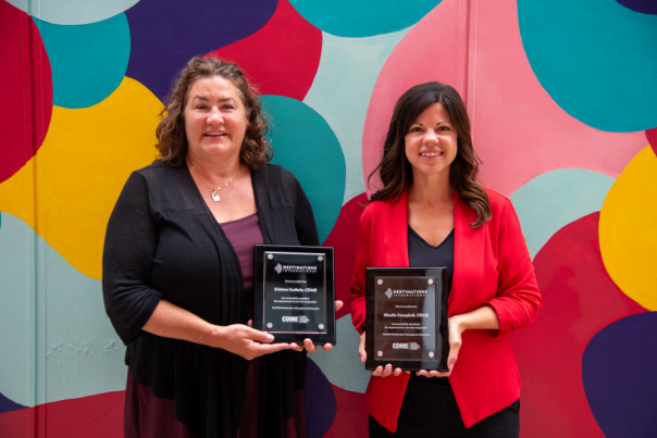 Kristen Guthrie and Nicolle Campbell holding their CDME plaques.