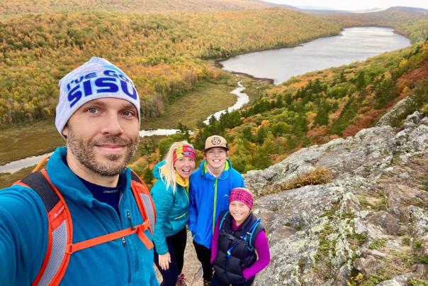 An image of a family hiking at Lake of the Clouds, located in Michigan's Upper Peninsula, USA