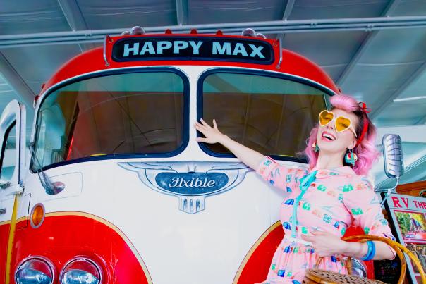 Pinup girl posing in front of Happy Max RV