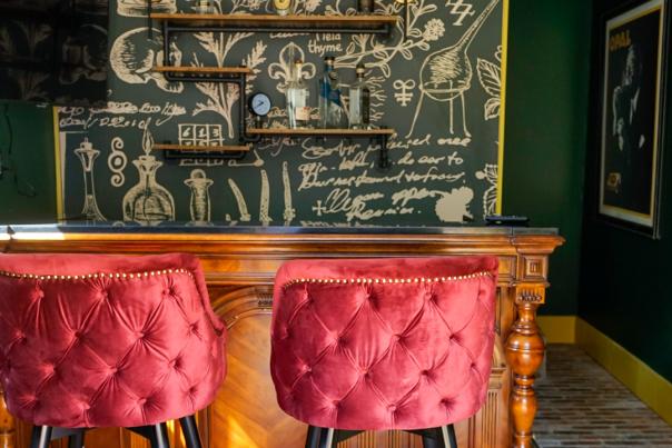 red velvet chairs at a bar