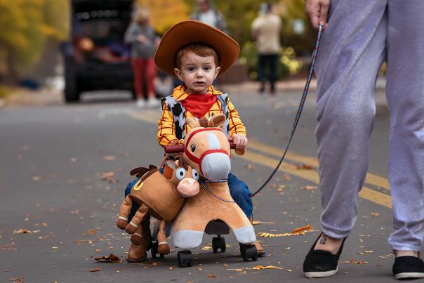 Kid in Costume Walking in Downtown's Spooktacular