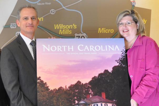 Bentonville Battlefield is featured on the cover of the 2015 NC Travel Guide, presented to Lynn Daniels, Donna Bailey-Taylor and Donny Taylor by Wit Tuttell.